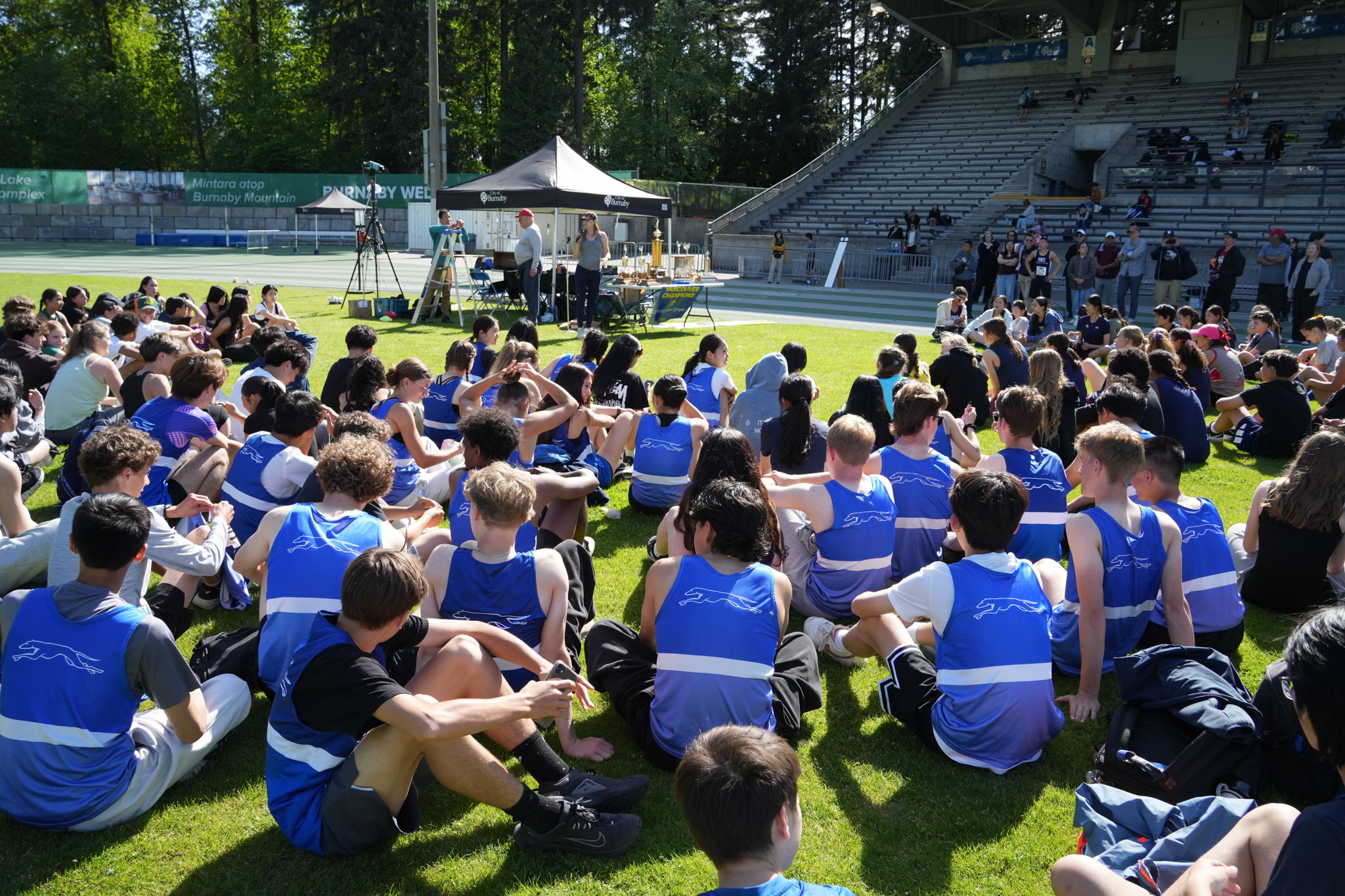 Zones meet athletes holding the zone champions sign