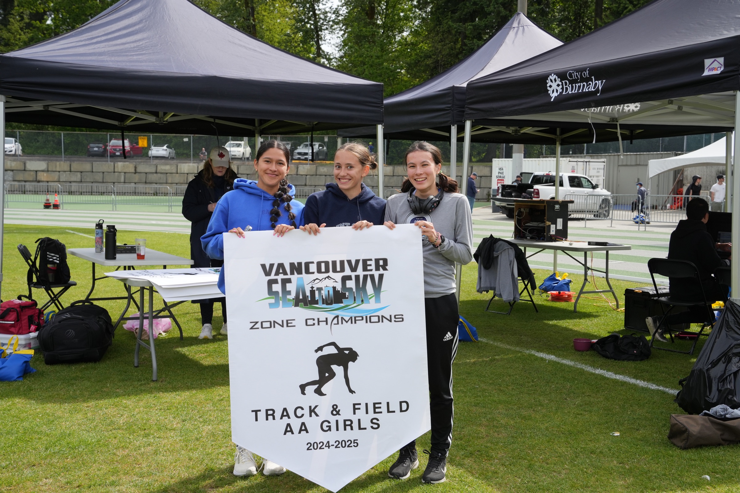 Zones meet athletes holding the zone champions sign